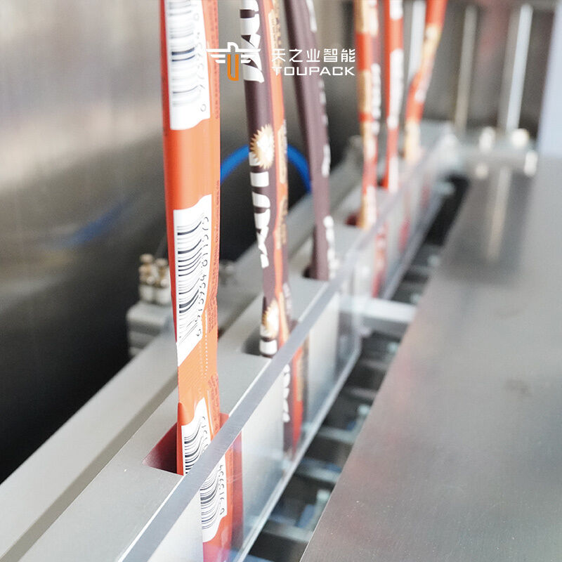 Automatic Multi Lane 50ml 100ml Liquid Sachet Fruit Juice Ice Lolly Pop Jelly Stick Strip Sachet Packing Machine